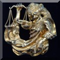 J01. 18K Gold scales of justice brooch. 